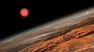 This_artist’s_impression_shows_an_imagined_view_from_close_to_one_of_the_three_planets_orbiting_an_ultracool_dwarf_star_just_40_light-years_from_Earth_that_were_discovered_using_the_TRAPPIST_telescope_at_ESO’s_La_Silla_Observatory._These_worlds_have_sizes